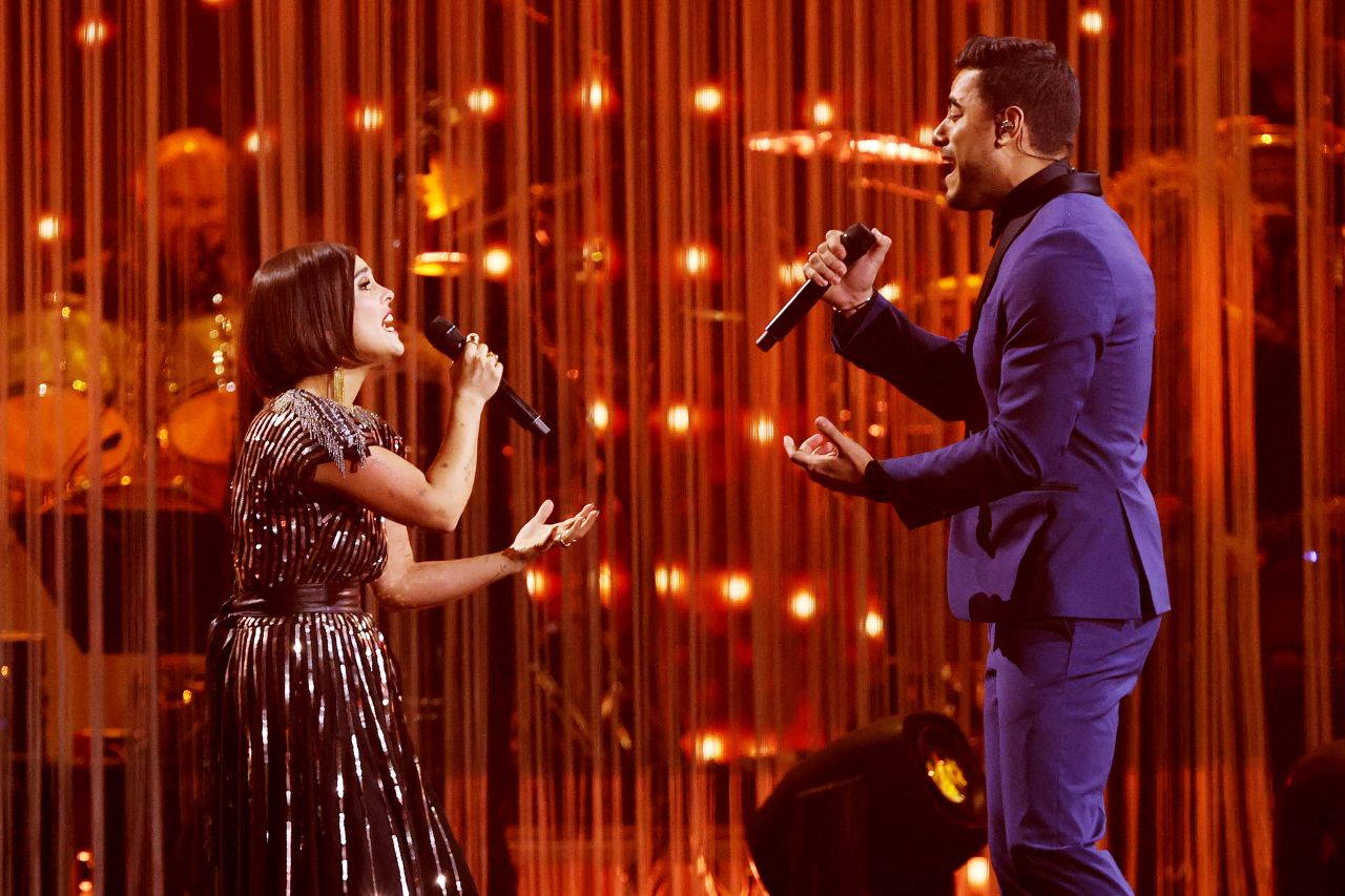 Paula Arenas and Carlos Rivera perform "Esta Tarde Vi Llover," as part of a <a href="https://www.cnn.com/entertainment/live-news/latin-grammys-2021/h_c8e7338c4eea0d50e5027e67db4f799a" target="_blank">tribute to Mexican singer</a> and composer Armando Manzanero. Manzanero died last year after battling Covid-19 for weeks. 
