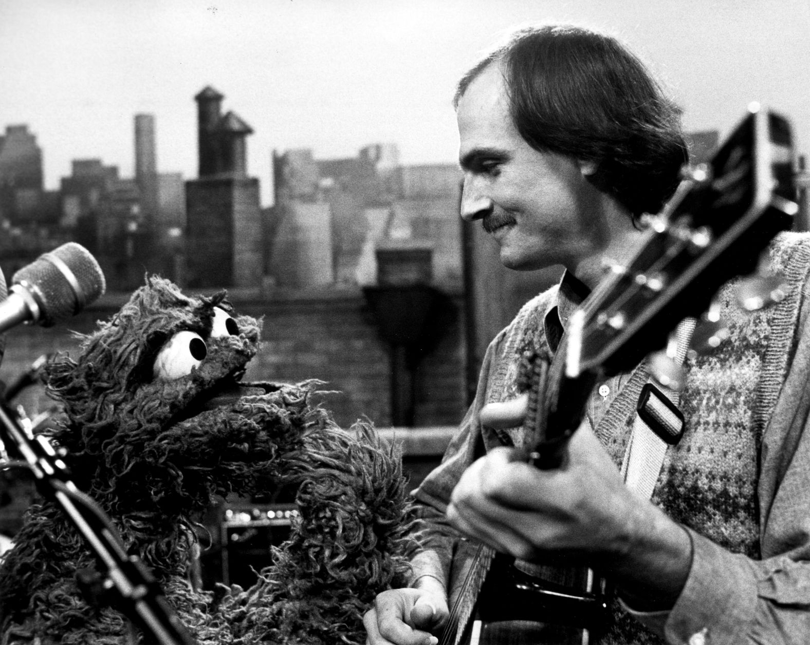 "Whenever I see your grouchy face it makes me want to smile because I like you, just a little bit," Taylor sang to Oscar the Grouch on <a href="index.php?page=&url=https%3A%2F%2Fwww.youtube.com%2Fwatch%3Fv%3DhQRvxcTCZ0E" target="_blank" target="_blank">"Sesame Street" </a>in 1983. "When you give me that nasty little frown, it turns me upside down." Oscar declares their duet is "rotten."