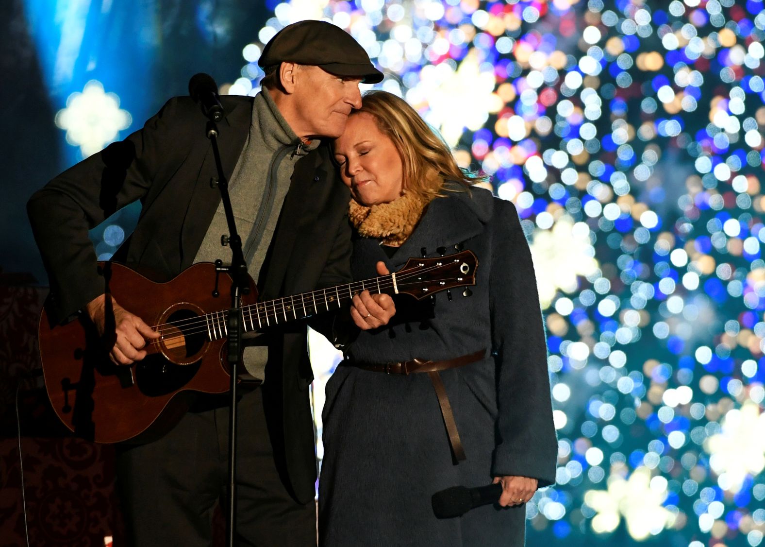Taylor and his wife Caroline Smedvig perform during the<a href="index.php?page=&url=https%3A%2F%2Fwww.cnn.com%2F2016%2F12%2F01%2Fpolitics%2Fobama-christmas-tree%2Findex.html" target="_blank"> 94th Annual National Christmas Tree Lighting </a>ceremony near the White House in 2016. Taylor and Smedvig married in 2001.