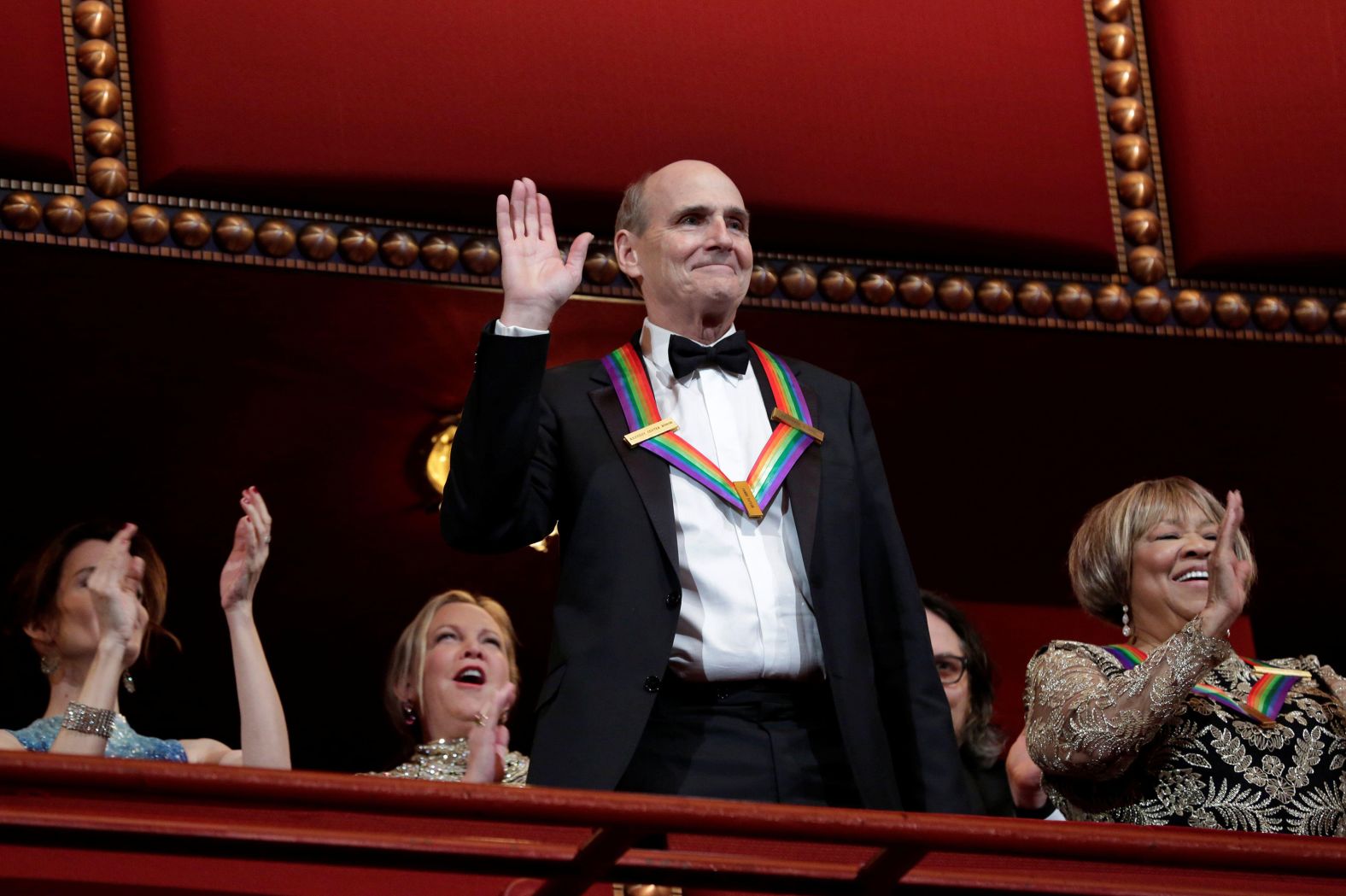 Taylor waves as he is greeted at the <a href="index.php?page=&url=https%3A%2F%2Fwww.cnn.com%2F2016%2F12%2F05%2Fentertainment%2Fkennedy-center-honors-al-pacino-james-taylor%2Findex.html" target="_blank">Kennedy Center Honors</a> in Washington in 2016. Taylor, Al Pacino, the surviving members of the Eagles (Don Henley, Timothy B. Schmidt and Joe Walsh), pianist Martha Argerich and gospel singer Mavis Staples were all honored for their influence on American culture.