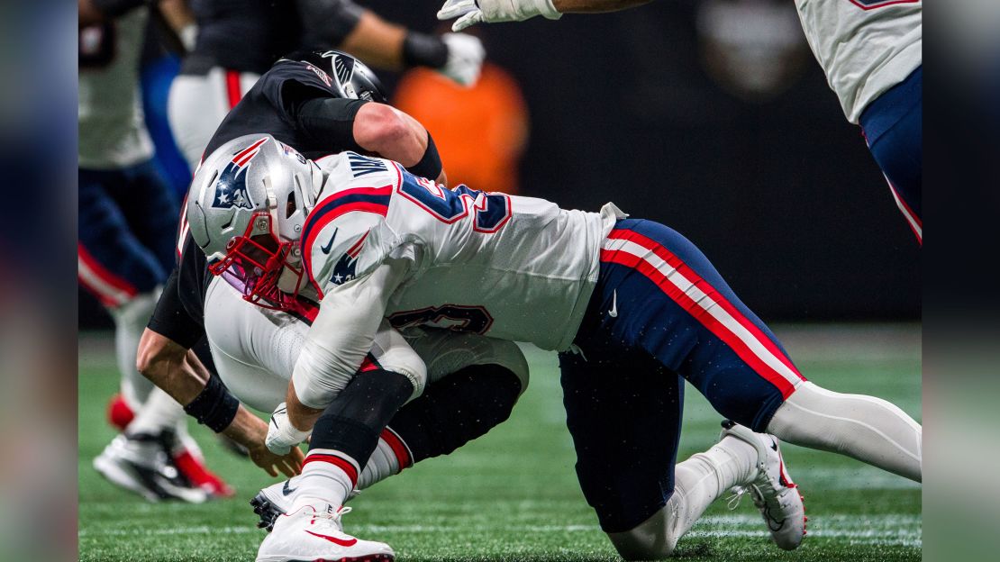 Ryan is sacked by New England Patriots linebacker Kyle Van Noy.