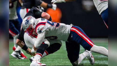 Ryan is sacked by New England Patriots linebacker Kyle Van Noy.