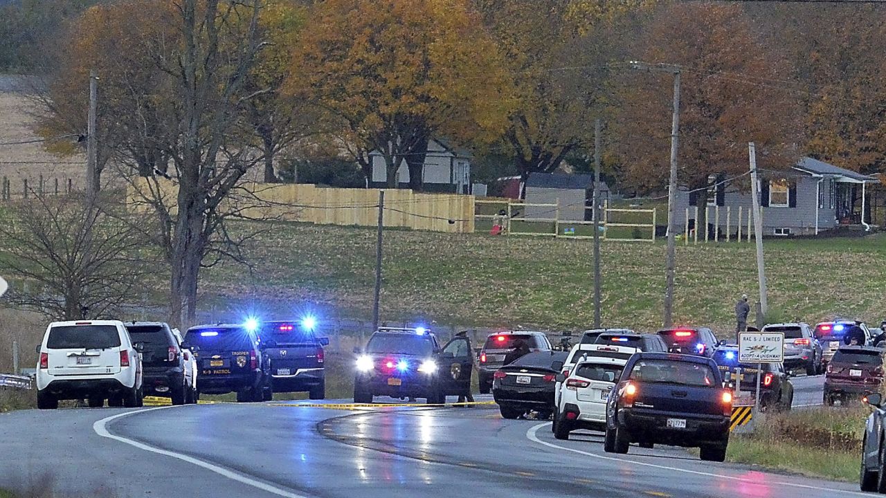 Authorities work at the scene where four people were found dead in a vehicle -- in what police say was a murder-suicide incident -- on Thursday outside Ringgold, Maryland.