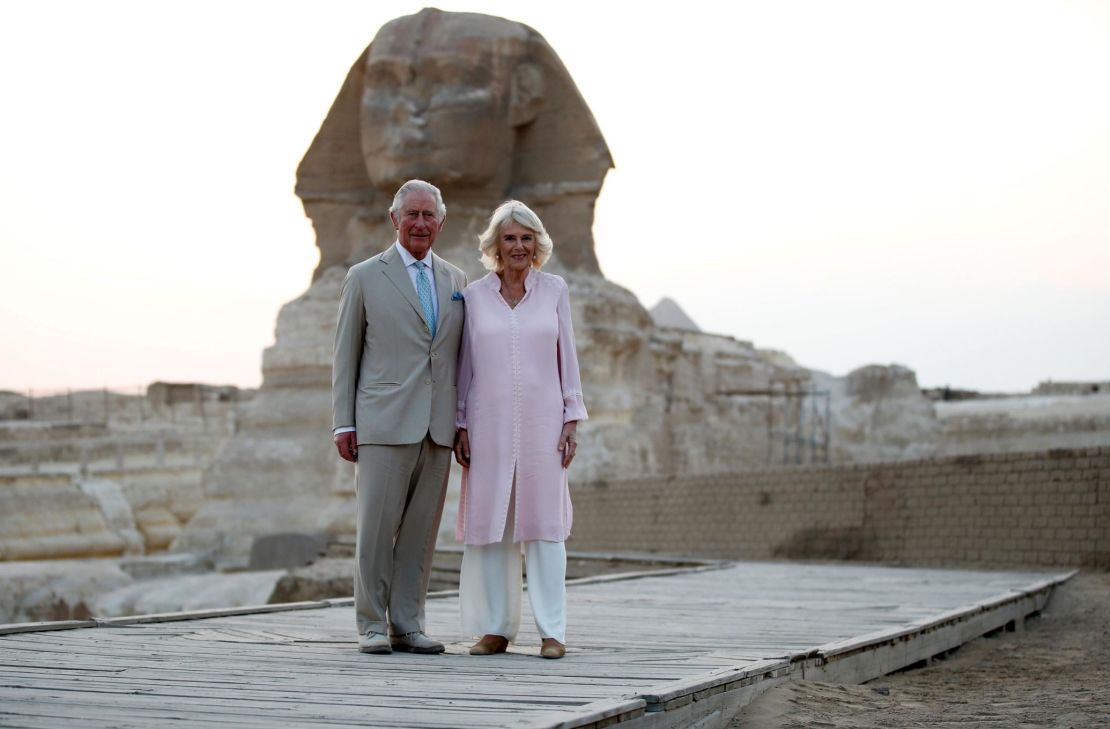 The couple pose in front of the Sphinx, on the outskirts of Cairo.