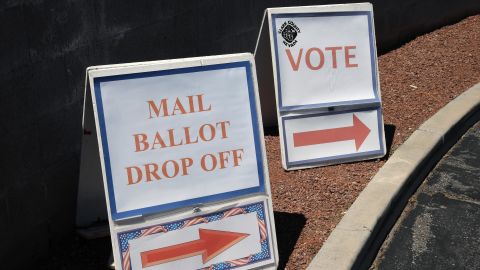 Signs direct people to the entrance of a primary election ballot drop-off point and an in-person voting center amid the coronavirus pandemic on June 9, 2020 in North Las Vegas, Nevada. 