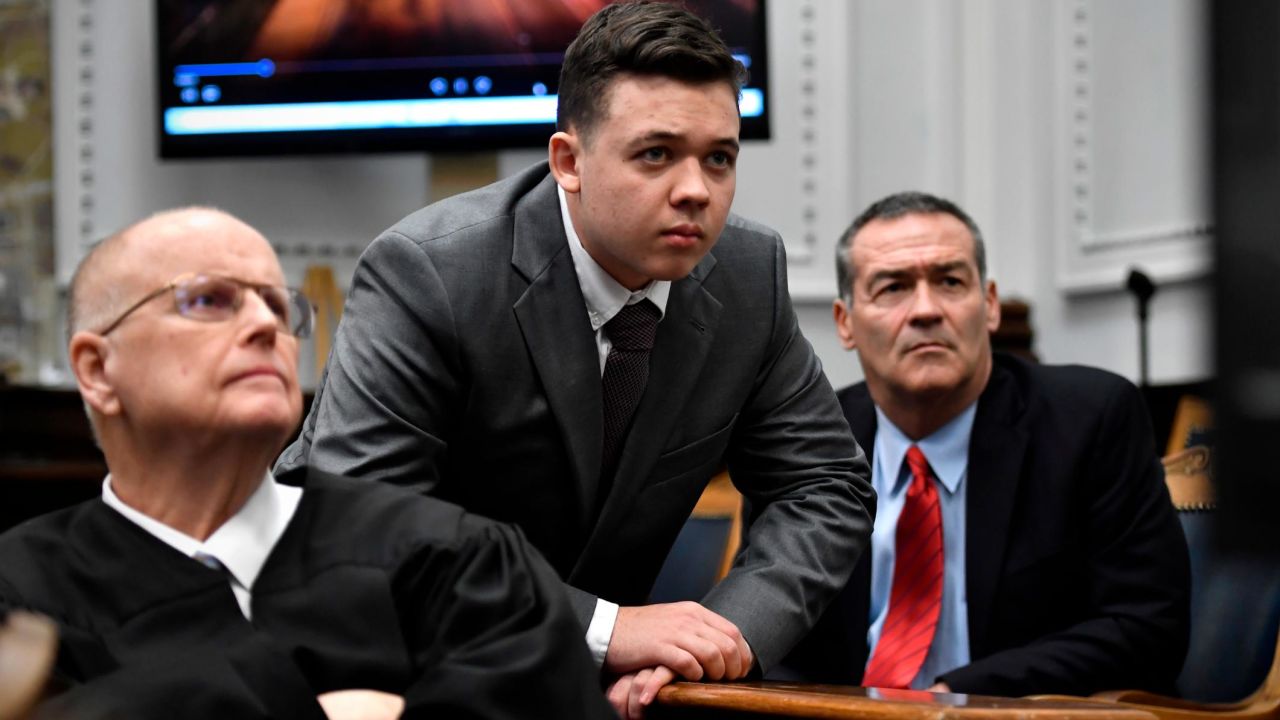Judge Bruce Schroeder, left, Kyle Rittenhouse, center, and his attorney Mark Richards watch an evidence video during Rittenhouse's trial  on November 12, 2021 in Kenosha, Wisconsin.  