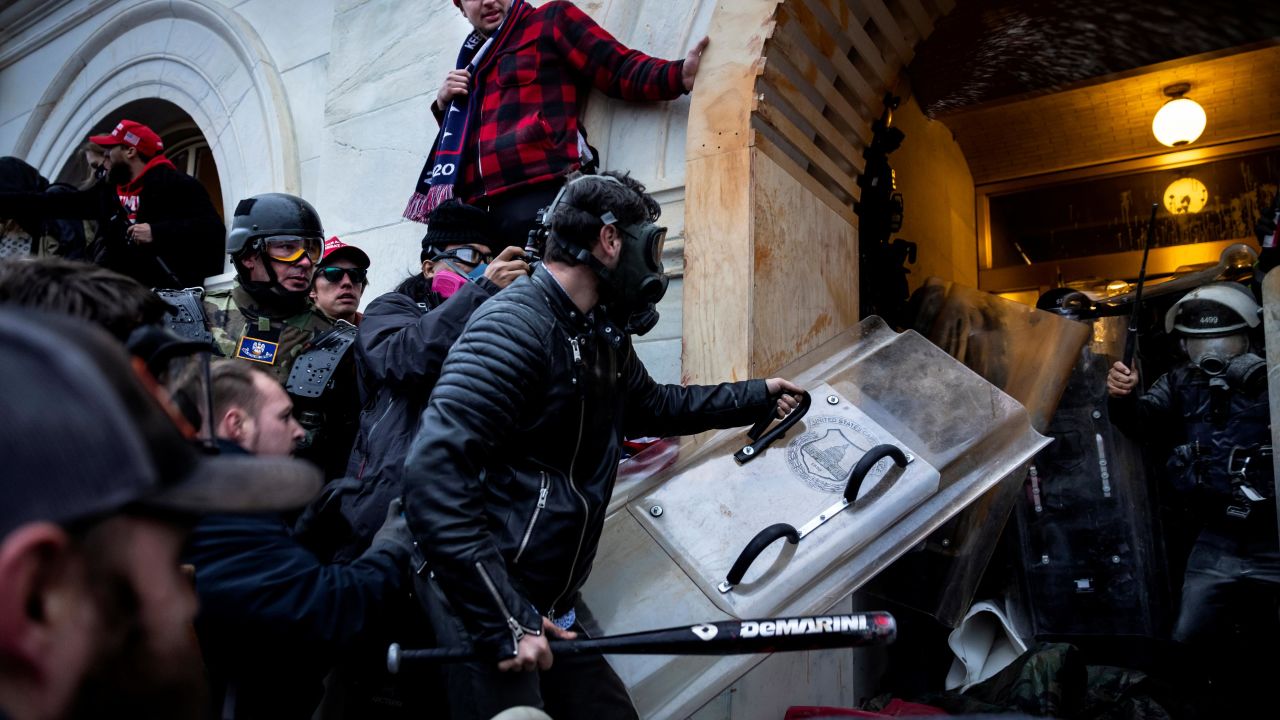 Trump supporters clash with police and security forces as they try to storm the US Capitol on January 6, 2021 in Washington.