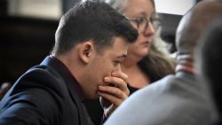 Kyle Rittenhouse puts his hand over his face after he is found not guilt on all counts at the Kenosha County Courthouse in Kenosha, Wis., on Friday, Nov. 19, 2021.  The jury came back with its verdict afer close to 3 1/2 days of deliberation.  (Sean Krajacic/The Kenosha News via AP, Pool)