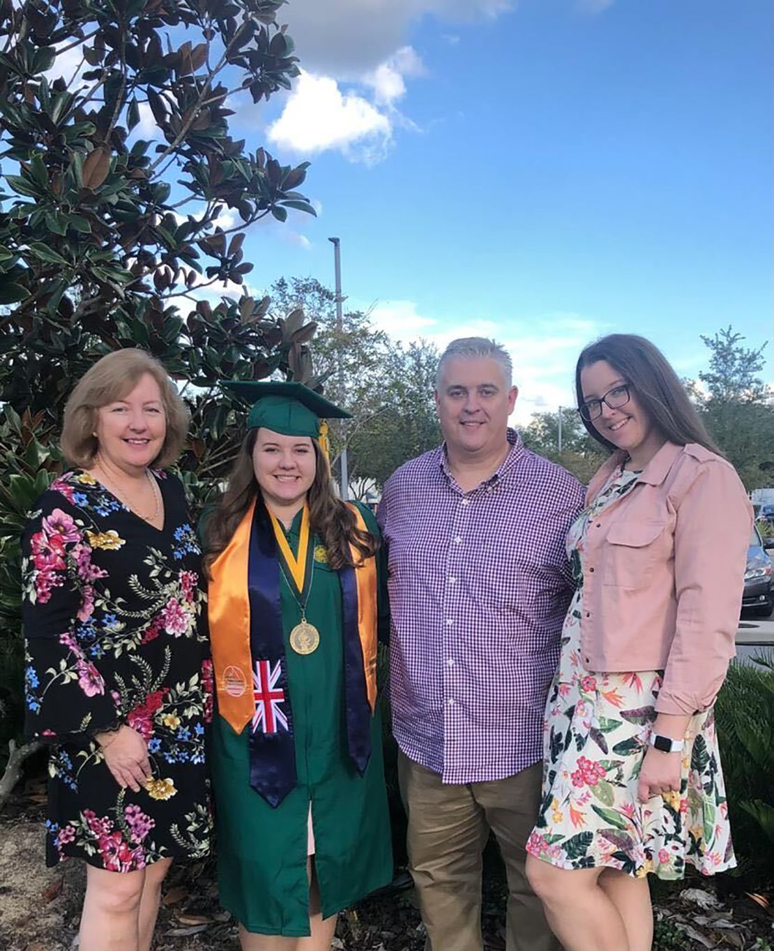 Erin Crosbie stands with her parents and sister after her graduation with a bachelor's in nursing from the University of South Florida. "I got what I though was the right degree, the right career path. ... I totally did not know that my whole life was about to get turned upside down," she says.