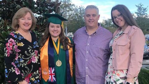 Erin Crosbie stands with her parents and sister after her graduation with a bachelor's in nursing from the University of South Florida. "I got what I though was the right degree, the right career path. ... I totally did not know that my whole life was about to get turned upside down," she says.