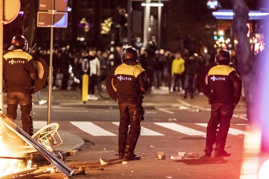 Rotterdam police shut down public transportation and ordered people to go home on Friday as protests escalated.