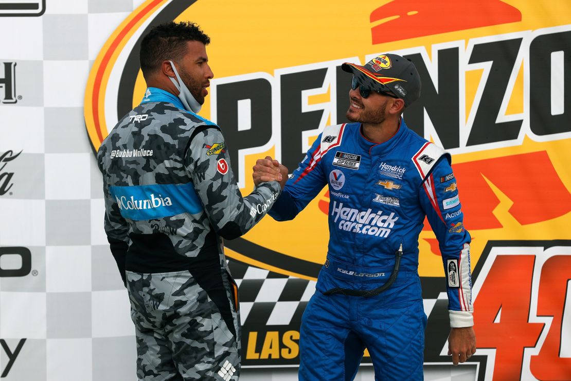 Kyle Larson, driver of the #5 HendrickCars.com Chevrolet, is congratulated by Bubba Wallace, driver of the #23 Columbia Sportswear Toyota, in Victory Lane after winning the NASCAR Cup Series Pennzoil 400 presented by Jiffy Lube at the Las Vegas Motor Speedway on March 07, 2021 in Las Vegas, Nevada.