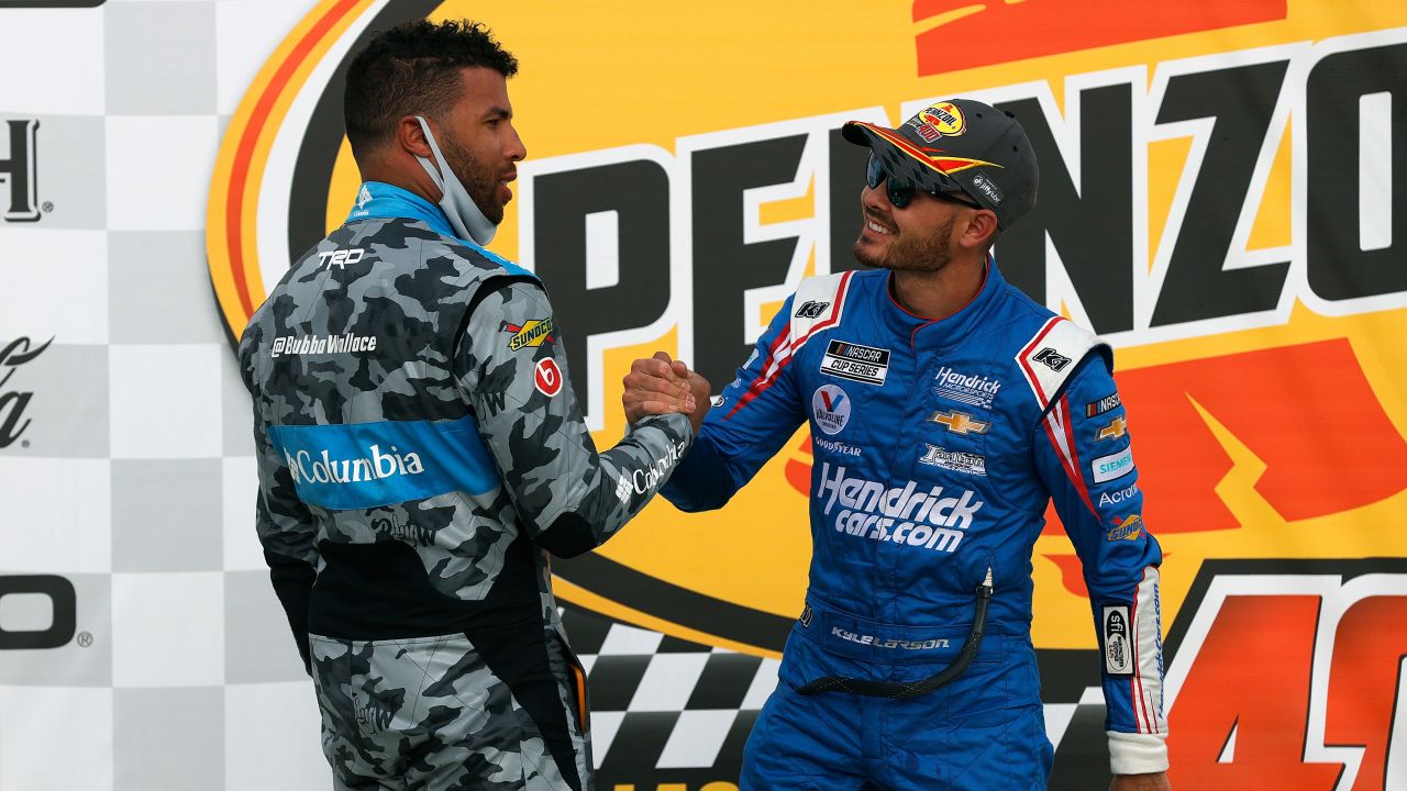 Kyle Larson, driver of the #5 HendrickCars.com Chevrolet, is congratulated by Bubba Wallace, driver of the #23 Columbia Sportswear Toyota, in Victory Lane after winning the NASCAR Cup Series Pennzoil 400 presented by Jiffy Lube at the Las Vegas Motor Speedway on March 07, 2021 in Las Vegas, Nevada.