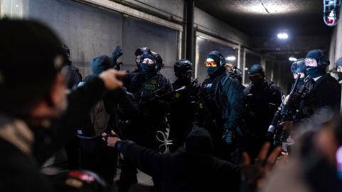 Protesters at an entrance of the Justice Center in Portland Friday.