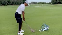 Screen grab of Tiger Woods taking golf shot. Video taken from his twitter video