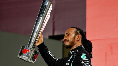 Lewis Hamilton celebrates on the podium after winning the Qatar Grand Prix.