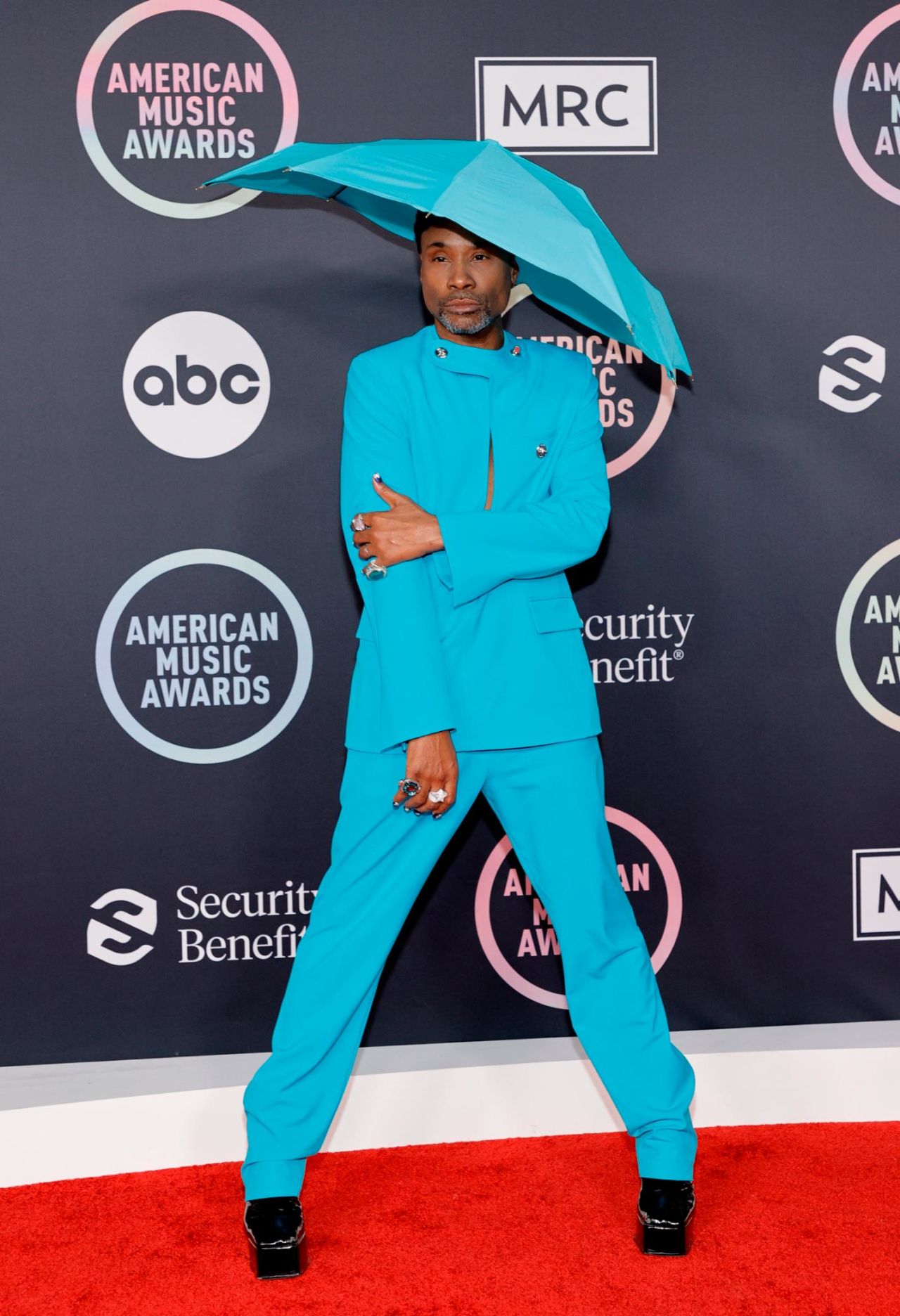 "Pose" star Billy Porter has made a name as one of the red carpet's most exciting arrivals, with his flamboyant, gender-fluid outfits. Porter turned to aquatic clothing brand Botter for his blue outfit, which featured a keyhole cut out and an umbrella-shaped hat -- paired with a pair of black glossy platform heels.
