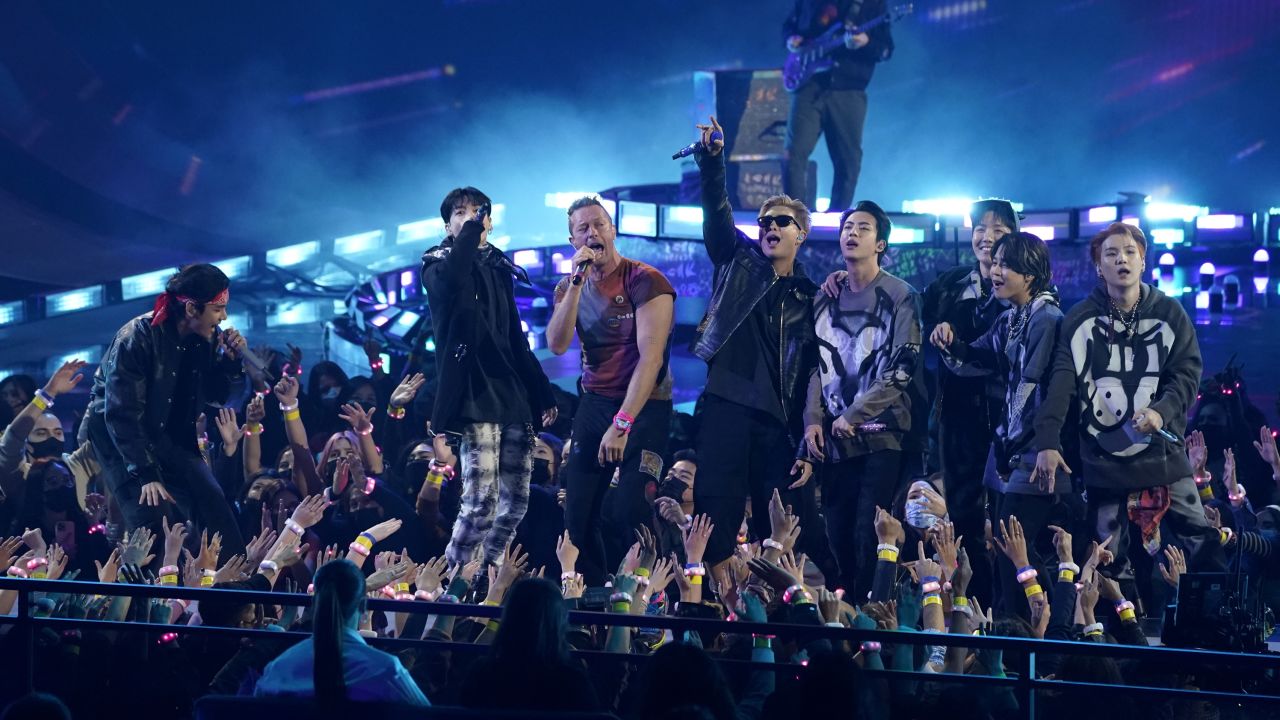 Coldplay and BTS perform "My Universe" at the American Music Awards on Sunday, Nov. 21, 2021 at Microsoft Theater in Los Angeles. (AP Photo/Chris Pizzello)