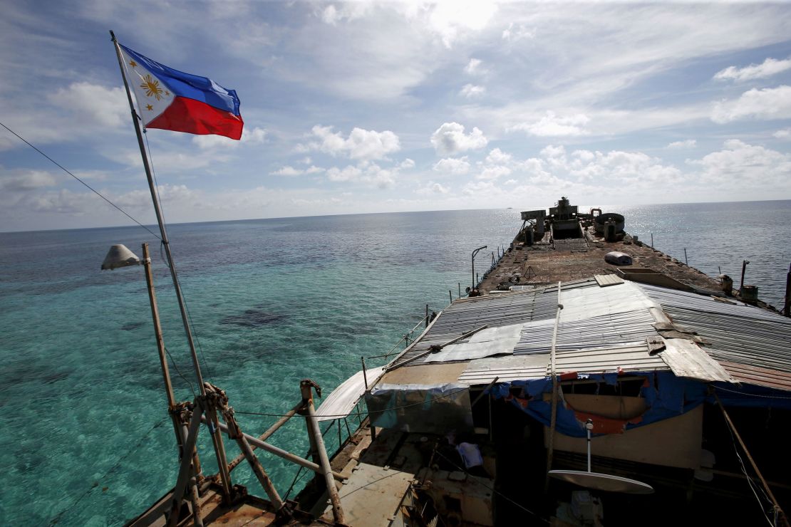 In this 2014 photo, a Philippine flag flutters from BRP Sierra Madre, a dilapidated Philippine Navy ship that has been aground since 1999 and became a Philippine military detachment on the disputed Second Thomas Shoal.