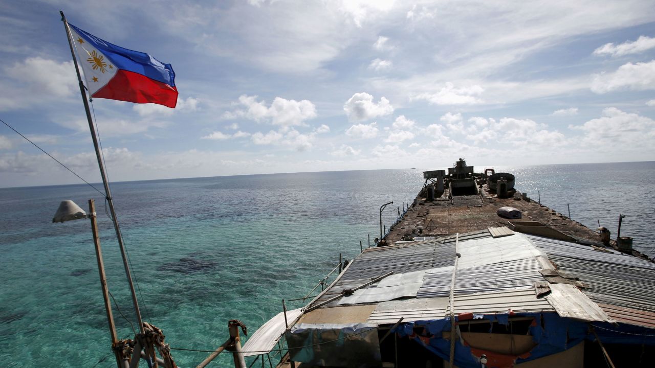 In this 2014 photo, a Philippine flag flutters from BRP Sierra Madre, a dilapidated Philippine Navy ship that has been aground since 1999 and became a Philippine military detachment on the disputed Second Thomas Shoal.