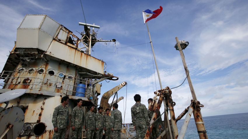 Members of Philippine Marines is pictured at BRP Sierra Madre, a dilapidated Philippine Navy ship that has been aground since 1999 and became a Philippine military detachment on the disputed Second Thomas Shoal, part of the Spratly Islands, in the South China Sea March 29, 2014. Picture taken March 29, 2014.  REUTERS/Erik De Castro