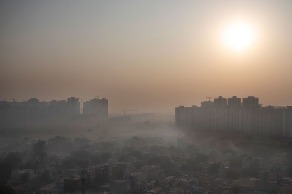 Morning haze envelops the skyline on the outskirts of New Delhi, India in October 2020. 