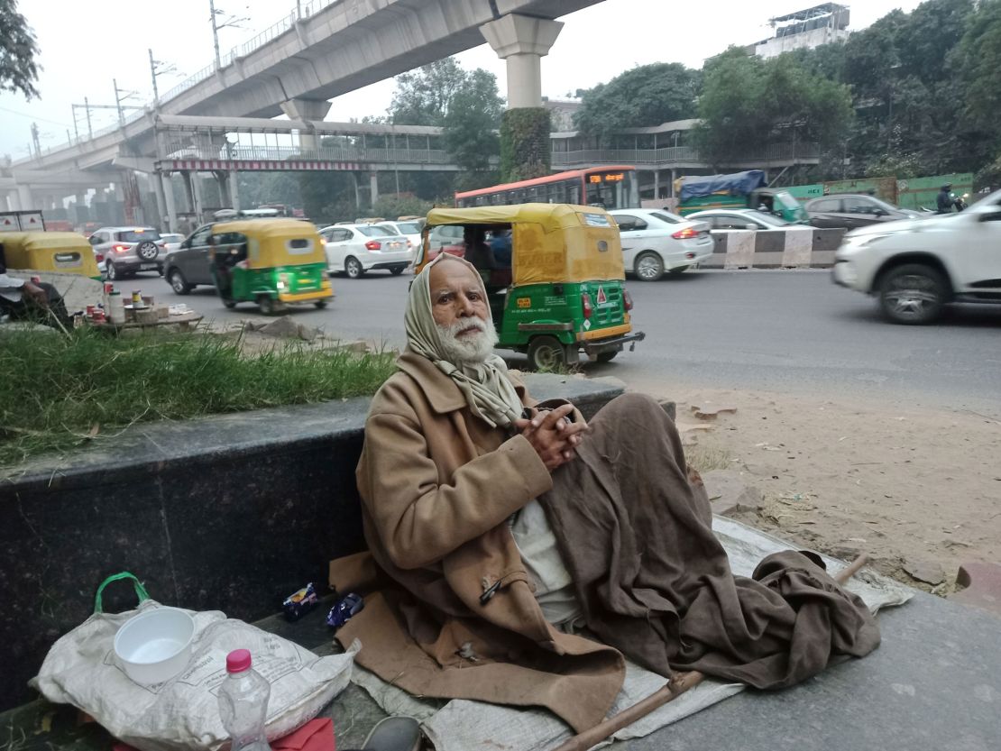 Gulpreet Singh begs for food outside Delhi's South Campus station. He struggles to breathe in the pollution. 
