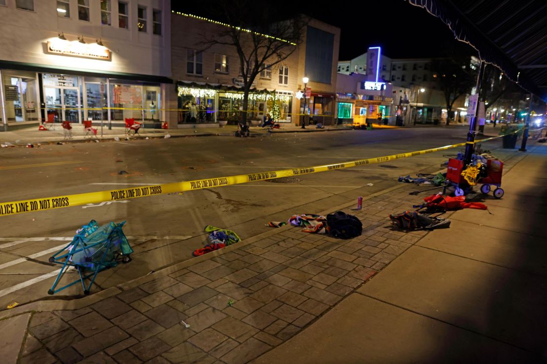 Police tape cordons off a street in Waukesha, Wisconsin, after an SUV plowed into a Christmas parade hitting multiple people Sunday, November 21, 2021. 