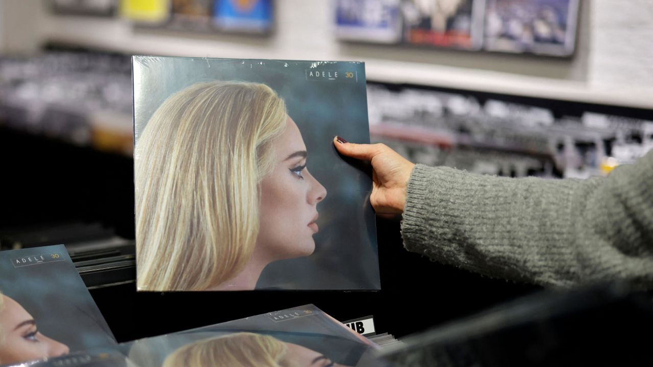 A member of staff sorts copies of Adele's new album "30" in Sister Ray record store in central London on November 19, 2021. 