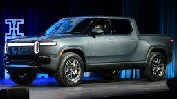 The Rivian R1T arrives on stage as a 2022 Truck of the Year Finalist at the LA Auto Show in Los Angeles, California on November 17, 2021. 