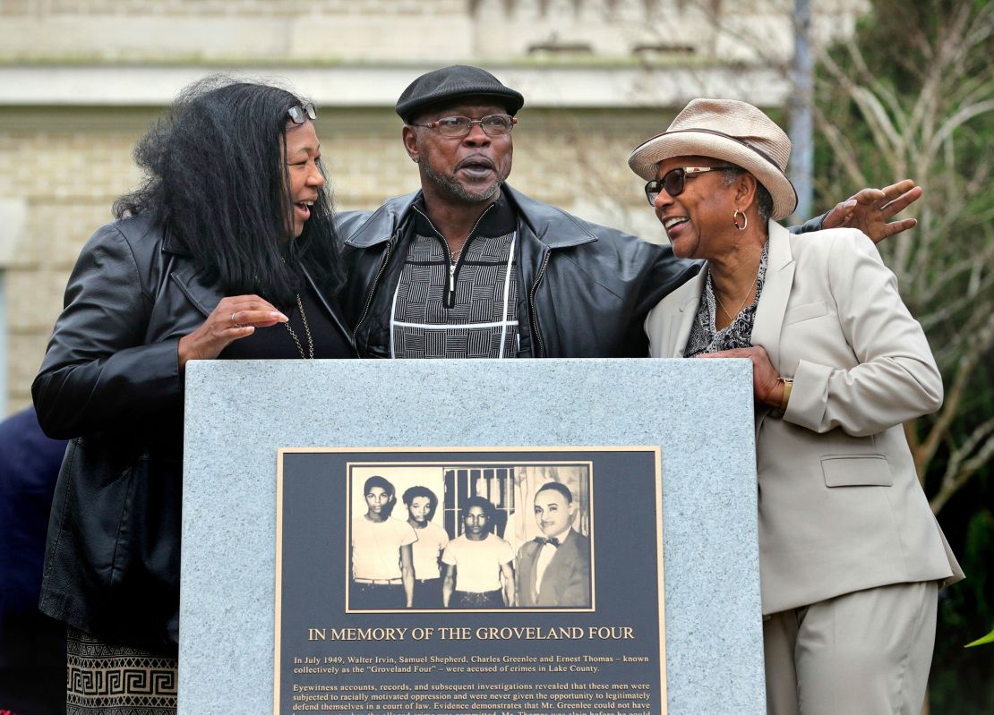 Relatives of the Groveland Four, from left, Vivian Shepherd, niece of Sam Shepherd, Gerald Threat, nephew of Walter Irvin; Carol Greenlee, daughter of Charles Greenlee, gather at the just-unveiled monument in front of the Old Lake County courthouse in Tavares, Fla., last year. 