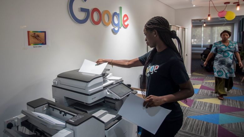 A woman makes copies at the Google Artificial Intelligence (AI) office in Accra on April 10, 2019. - This centre is the first AI centre established in Africa by Google. (Photo by CRISTINA ALDEHUELA / AFP) (Photo by CRISTINA ALDEHUELA/AFP via Getty Images)