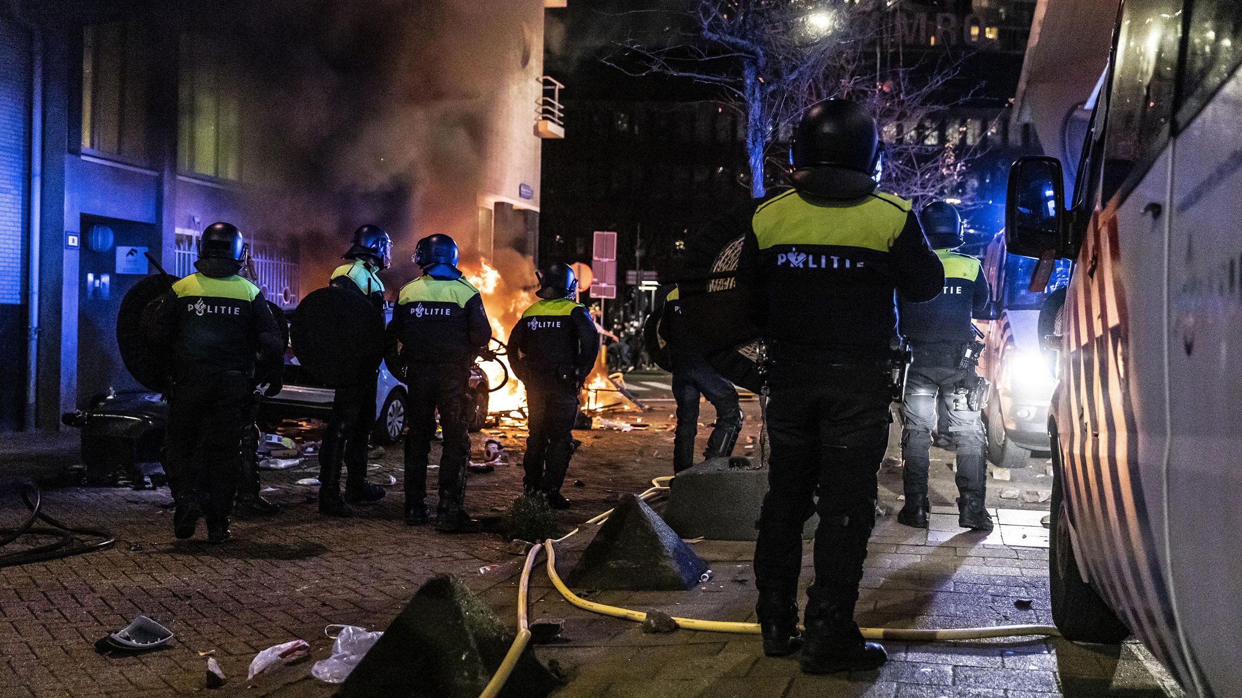 Police work at the scene of protests in Rotterdam on Friday.