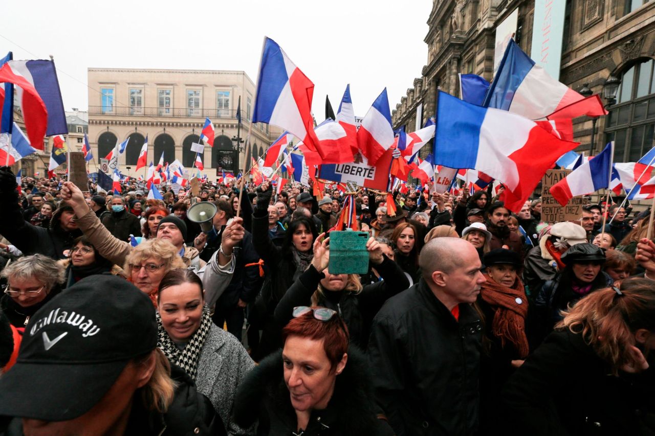 Members and supporters of the French Nationalist Party demonstrate in front of the Louvre Museum in Paris on Saturday. They were protesting against the Covid-19 health pass needed for certain activities in the country.