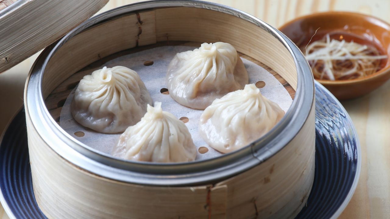 Xiaolongbao dumplings contain aspic, and are pinched, instead of folded.