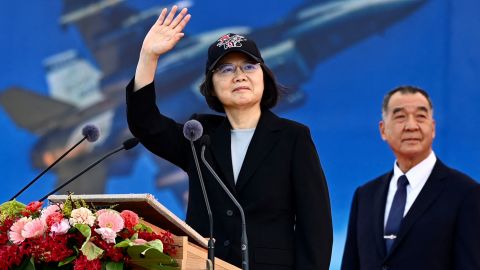 Taiwan President Tsai Ing-wen waves as Defence Minister Chiu Kuo-cheng looks on during a ceremony at the Chiayi Air Force in southern Taiwan on November 18, 2021.