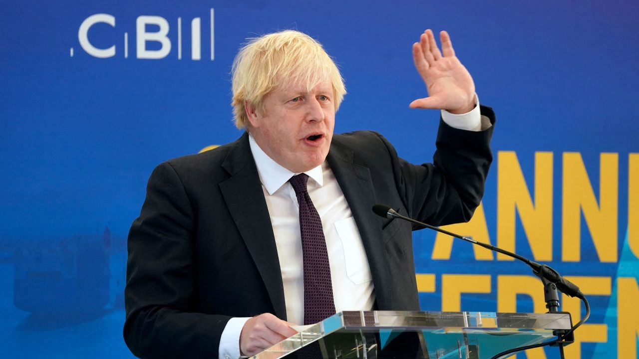 Britain's Prime Minister Boris Johnson speaks at the Confederation of Business Industry (CBI) annual conference, at the Port of Tyne, in South Shields, north east England on November 22, 2021. - Britain will make electric car chargers compulsory for new buildings in England from 2022, as it switches away from high-polluting vehicles, Prime Minister Boris Johnson said on Monday. Johnson, fresh from hosting the COP26 climate change summit, told business leaders that he will legislate to compel charging points in new homes, supermarkets and workplaces in England, as part of his carbon-slashing plans. (Photo by Owen Humphreys / POOL / AFP) (Photo by OWEN HUMPHREYS/POOL/AFP via Getty Images)