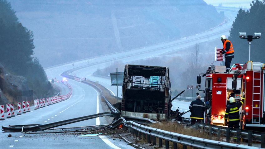 Firefighters and forensic workers inspect the scene of a bus crash which, according to authorities, killed at least 45 people on a highway near the village of Bosnek, western Bulgaria, Tuesday, Nov. 23, 2021. The bus, registered in Northern Macedonia, crashed around 2 a.m. and there were children among the victims, authorities said.
