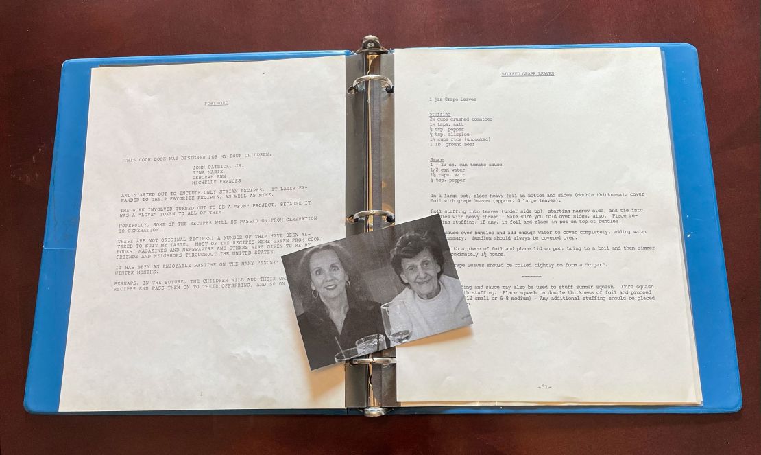 A picture of Michelle Watts and her mother Jessie Monis lays on top of a handmade cookbook that Monis made for her children in 1987. (Courtesy Michelle Watts)