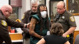 WAUKESHA, WISCONSIN - NOVEMBER 21: Darrell Brooks (C) appears at Waukesha County Court on November 23, 2021 in Waukesha, Wisconsin. Brooks is charged with killing five people and injuring nearly 50 after driving through a Christmas parade with his sport utility vehicle on November 21. (Photo by Mark Hoffman-Pool/Getty Images)