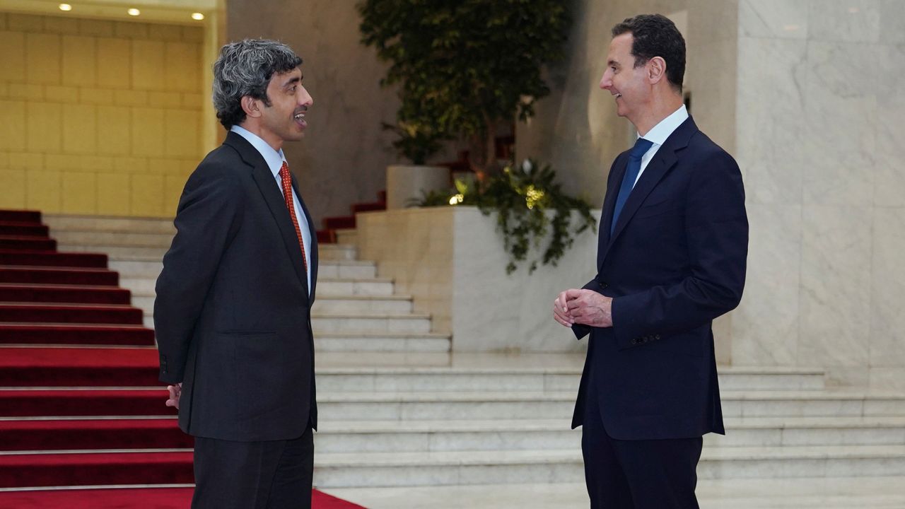 In this photo released by the Syrian official news agency SANA, shows Syrian President Bashar Assad, right, speaks with Sheikh Abdullah bin Zayed Al Nahyan, the Foreign Minister of the United Arab Emirates, in Damascus, Syria, Tuesday, Nov. 9, 2021. 