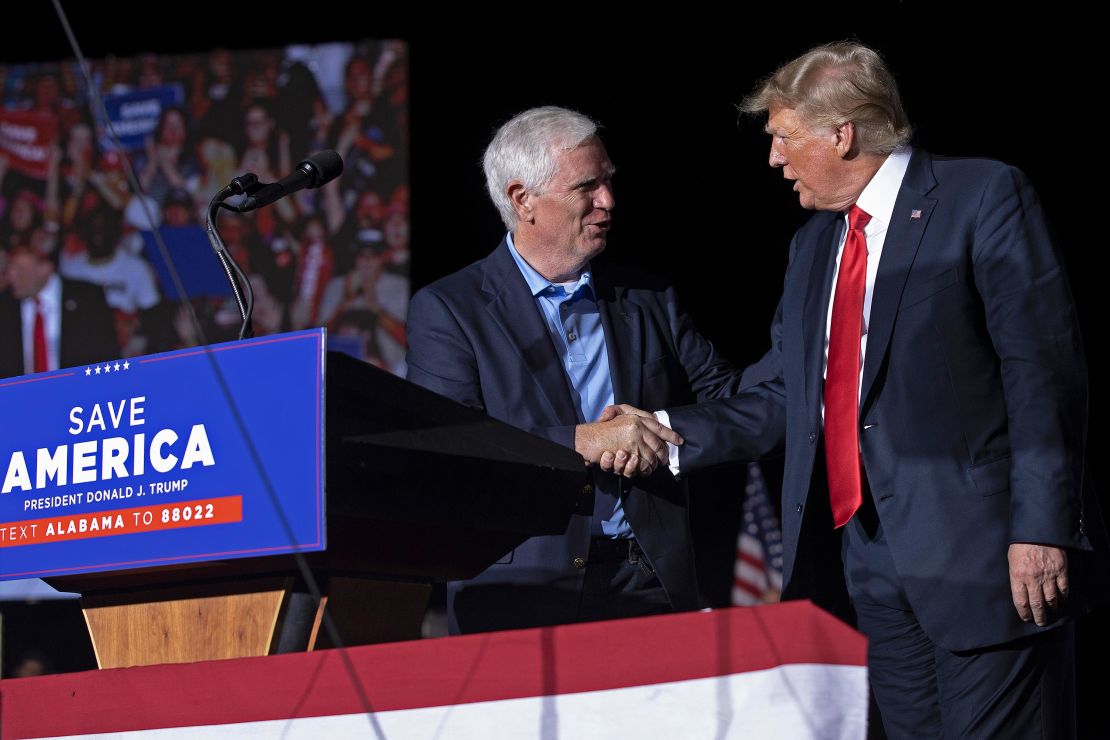 Trump welcomes Rep. Mo Brooks to the stage during a "Save America" rally on August 21, 2021 in Cullman, Alabama. 