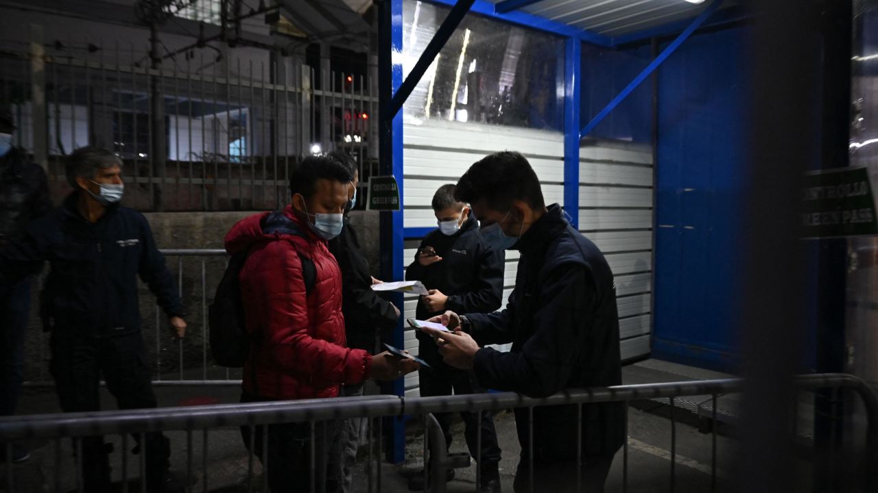 A man has his Green Pass checked on October 15 at the entrance of the Fincantieri shipyard in the port of Genoa.