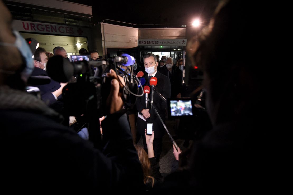 French Interior Minister Gerald Darmanin speaks to the press in front of a hospital in Calais, northern France, after at least 27 people died off the city's coast.