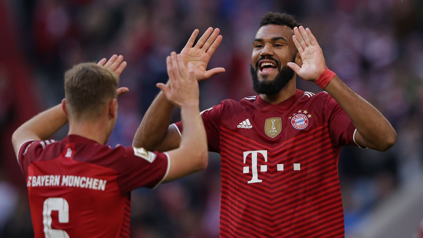 Eric Maxim Choupo-Moting celebrates with Joshua Kimmich after scoring in Bayern Munich's Bundesliga game against TSG Hoffenheim at the Allianz Arena on October 23, 2021 in Munich, Germany.
