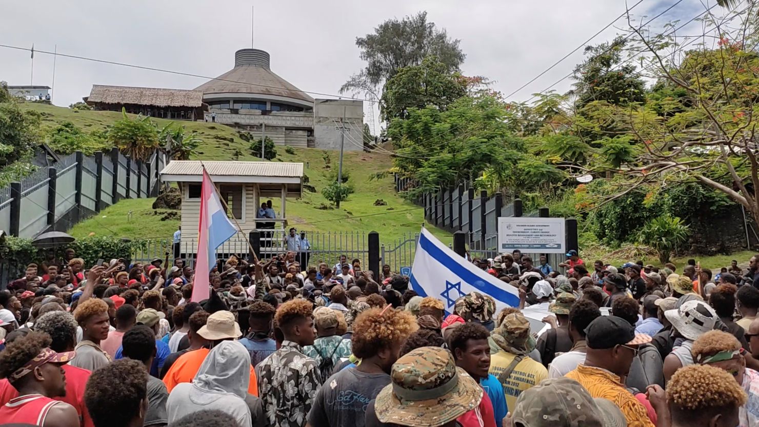 Protesters gather outside Parliament in Honiara, Solomon Islands, on November 24, 2021. 