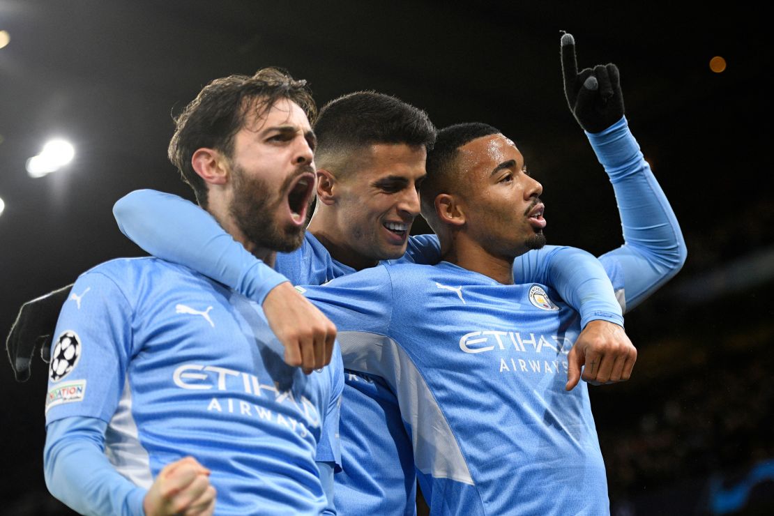 Gabriel Jesus (right), Joao Cancelo (center) and Bernardo Silva celebrate during City's comeback win. 