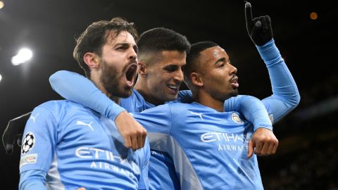 Gabriel Jesus (right), Joao Cancelo (center) and Bernardo Silva celebrate during City's comeback win. 