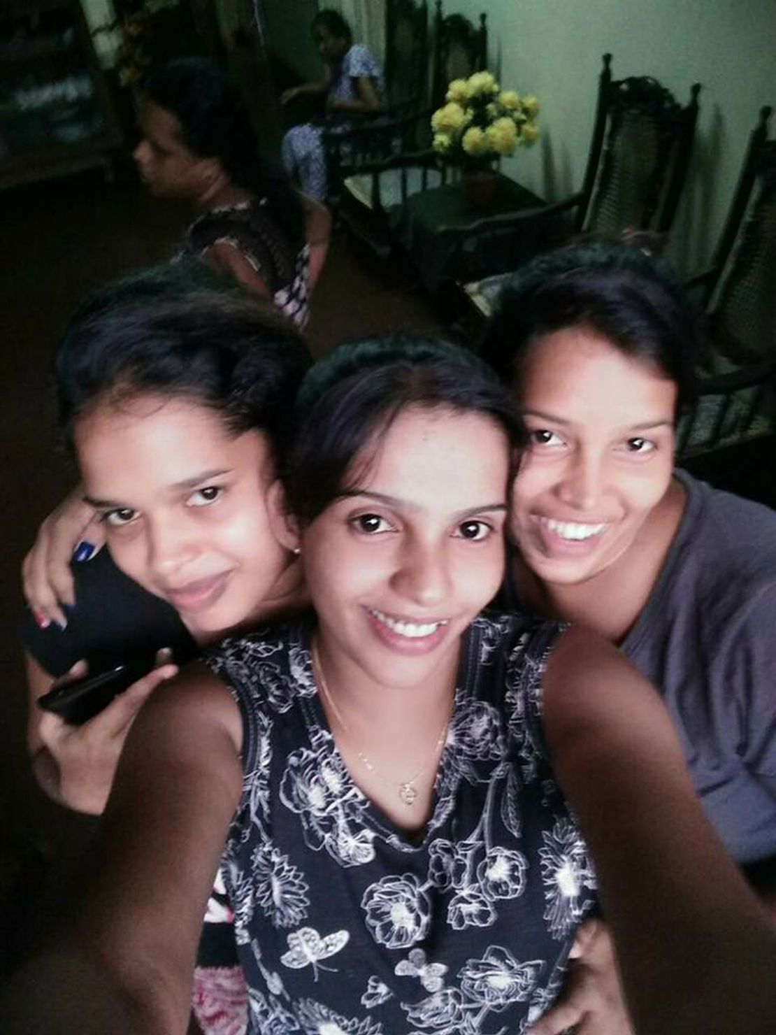 Wishma Rathnayake (center) with her younger sisters, Poornima Rathnayake (left) and Wayomi Rathnayake (right).