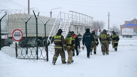 Investigators and rescuers arrive at Listvyazhnaya coal mine in the Kemerovo region near the town of Belovo after an accident on November 25, 2021. 